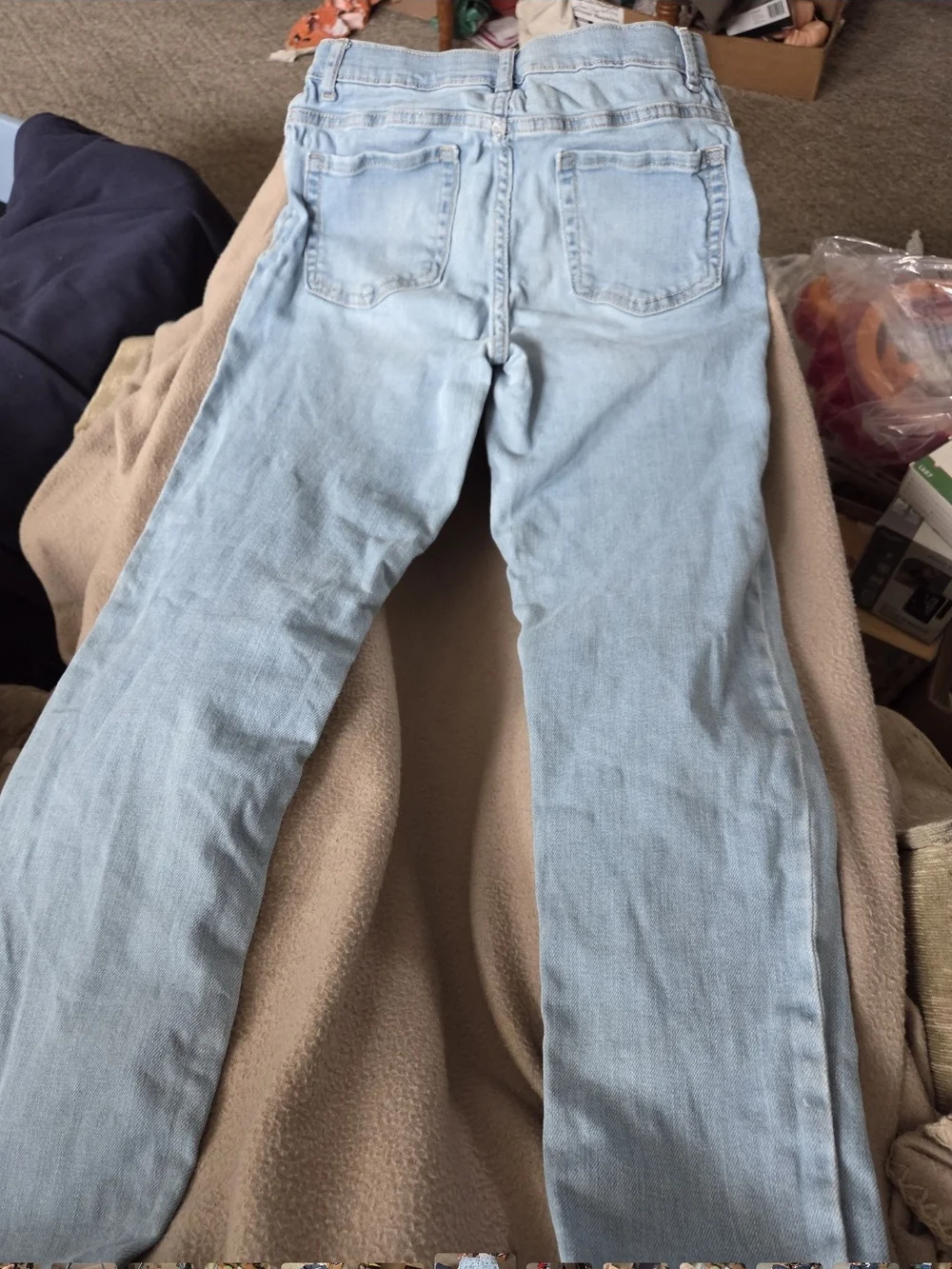 Place Light Wash Super Skinny Jeans with Pink Logo.